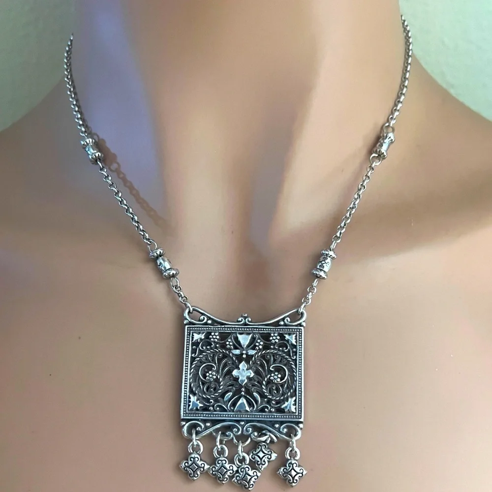 Brighton pendant necklace. Square pendant with loose charms. 10
